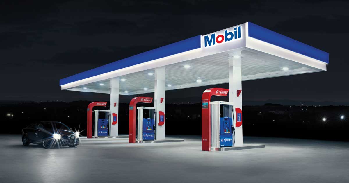 Mobil Station Night with Car Lit-up